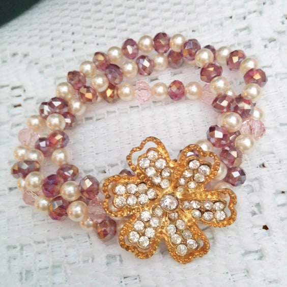 3 Strand Stretch Pearl and Crystal Bracelet With A Gold Plated Rhinestone Flower