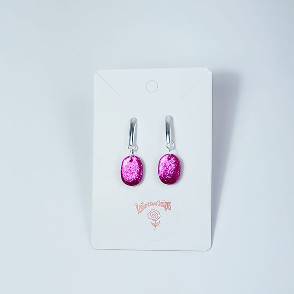 Cerise pink sparkle small oval dangle earrings               
