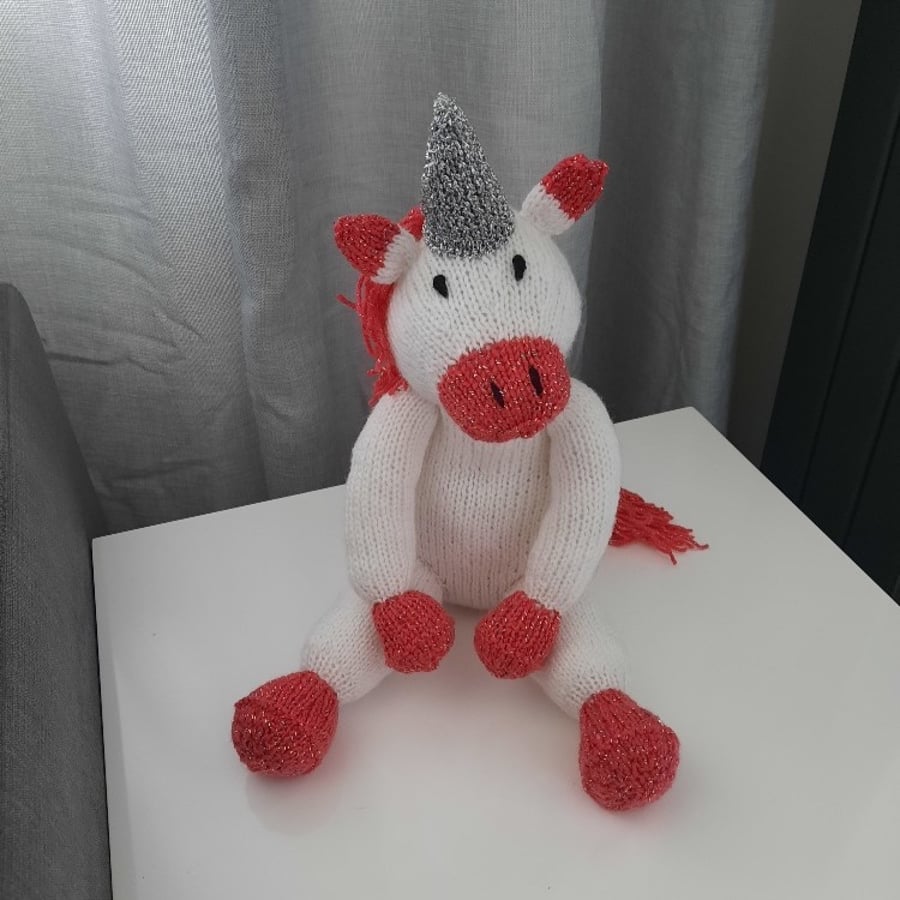 Hand knitted Aurora the Unicorn toy