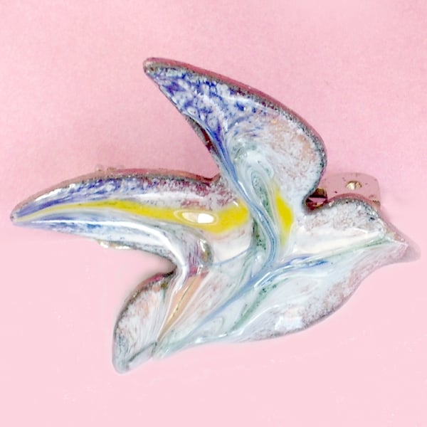 enamel brooch - bird scrolled blue and yellow over white