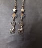 Wintry beaded star and leaf dangle earrings with silver stag charm  - Image 4