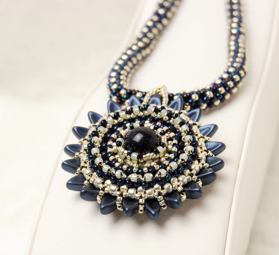 Gemstone beaded necklace with blue goldstone, Floral pendant, Beaded rope