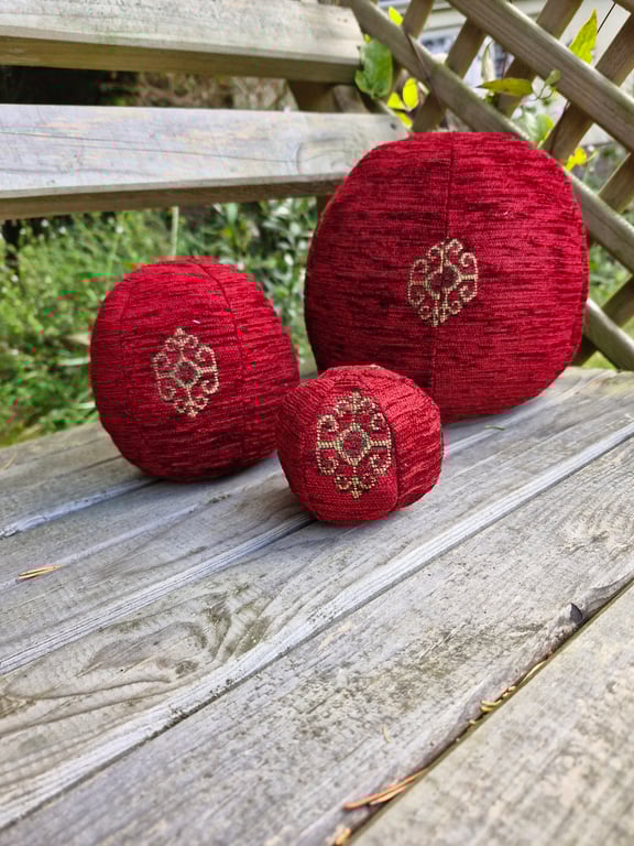 Large, decorative, christmas, red and gold fabric bauble ball.
