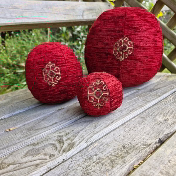 Large, decorative, christmas, red and gold fabric bauble ball.