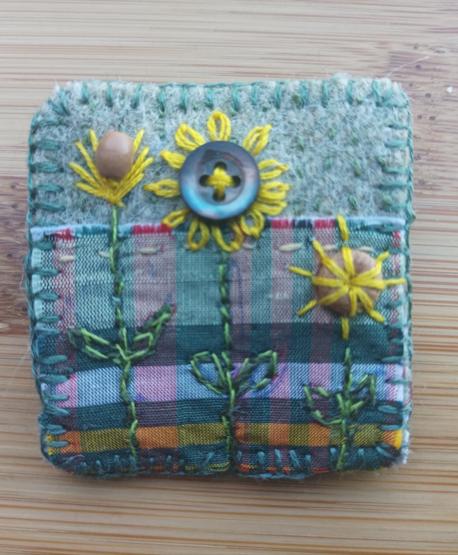 Brooch upcycled and hand stitched 