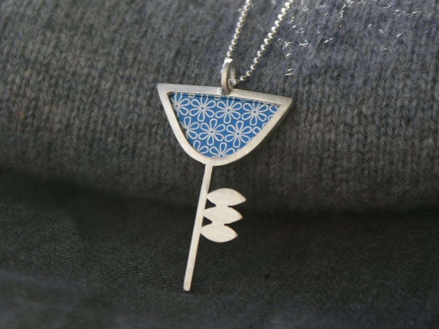 Silver and blue flower pendant
