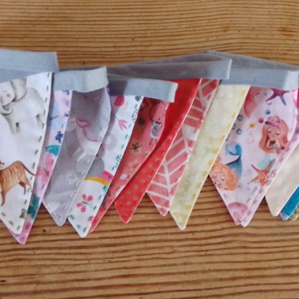 Handmade mini bunting in an animal and princess theme.