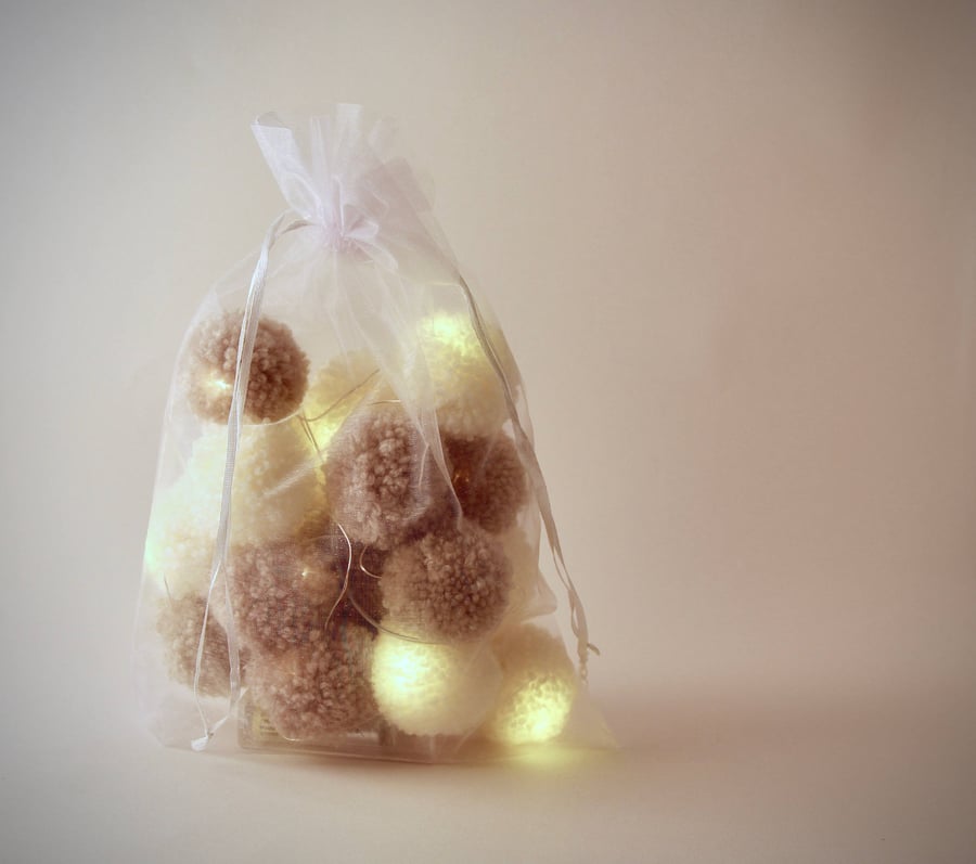 20 pom-pom LED fairy lights in latte and cream pom-poms.