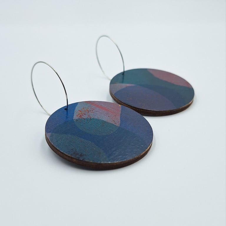 Big hooped dangly earrings with a hand printed abstract design