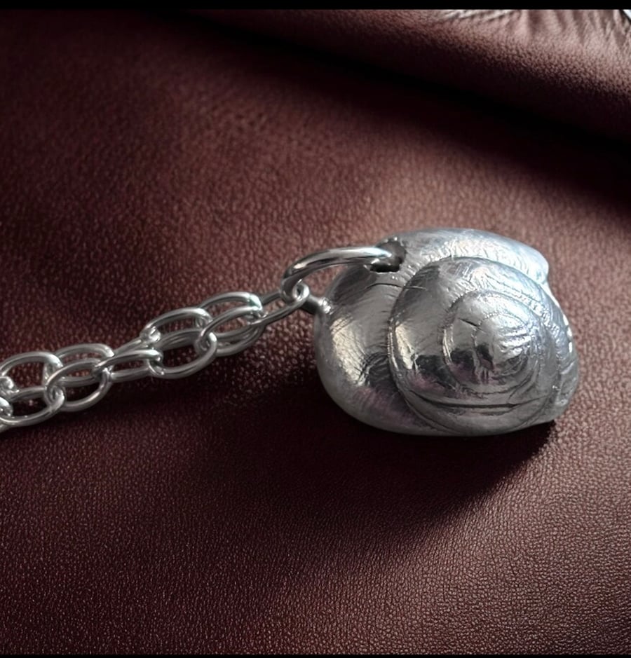 A snail charm bracelet