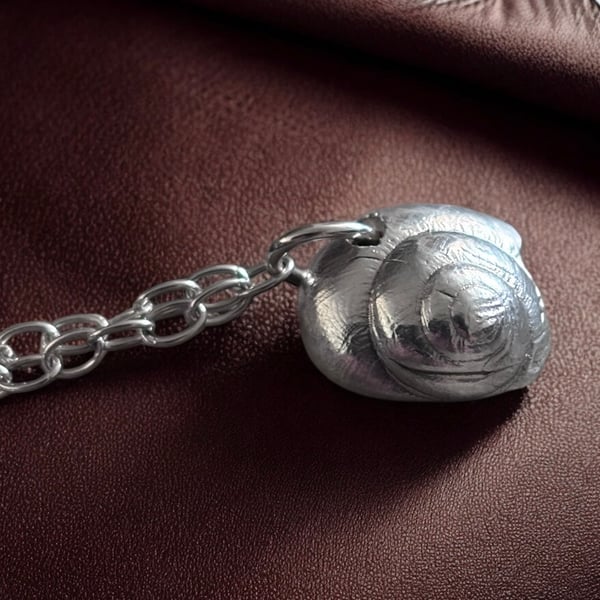 A snail charm bracelet