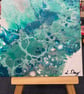 Easel mounted acrylic painted canvas in greens and blues - Image 2