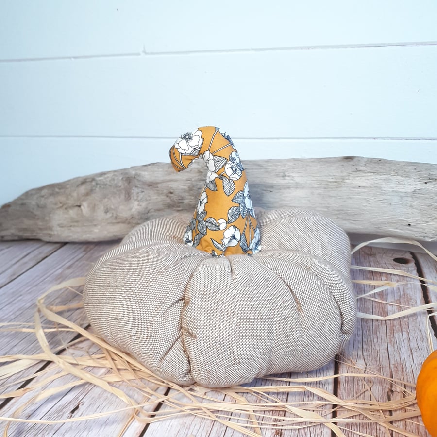 A cute squishy fabric pumpkin decoration