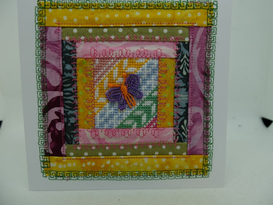 log cabin quilt block card with cross stitch inset and a butterfly