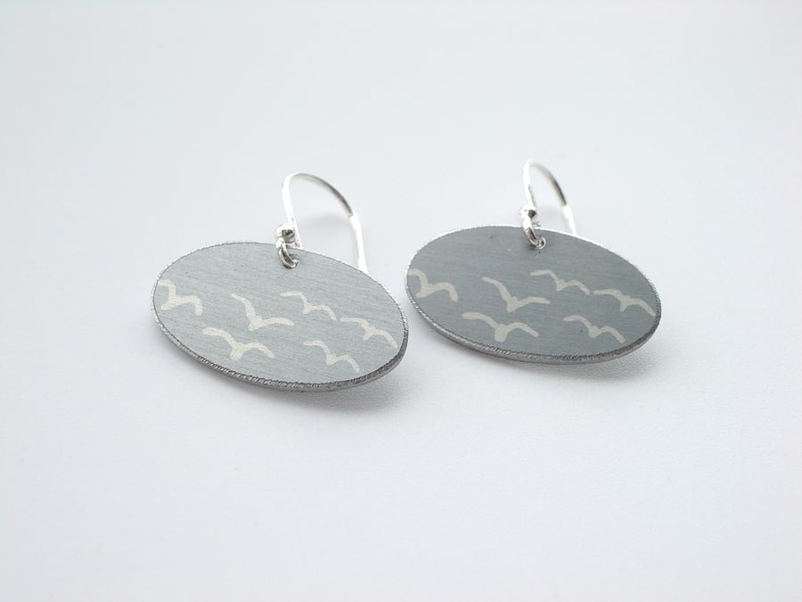 Grey oval earrings with seagull print