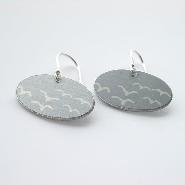 Grey oval earrings with seagull print