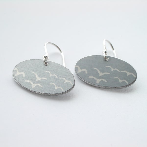 Grey oval earrings with seagull print. Perfectly imperfect.