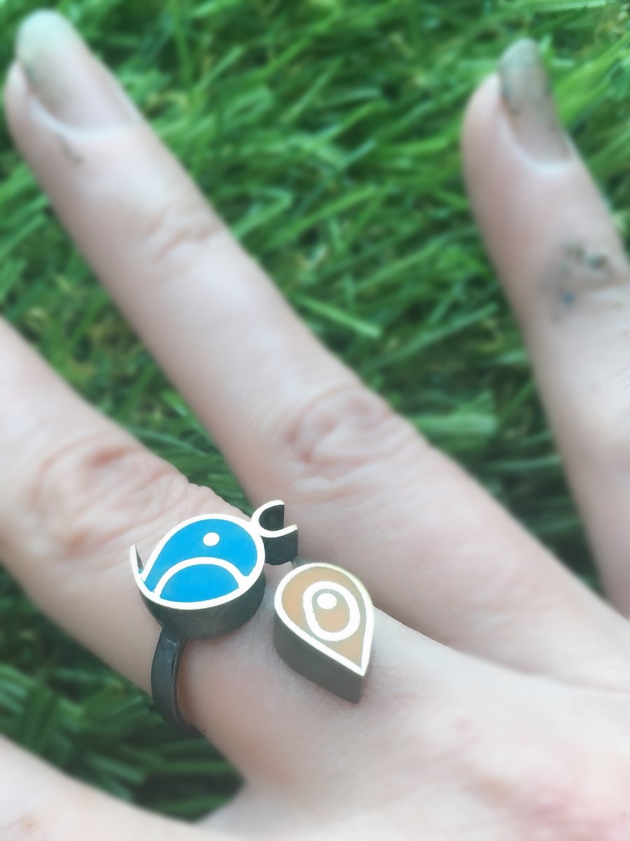 A bird and seed ring in Sterling silver  filled with coloured resin.