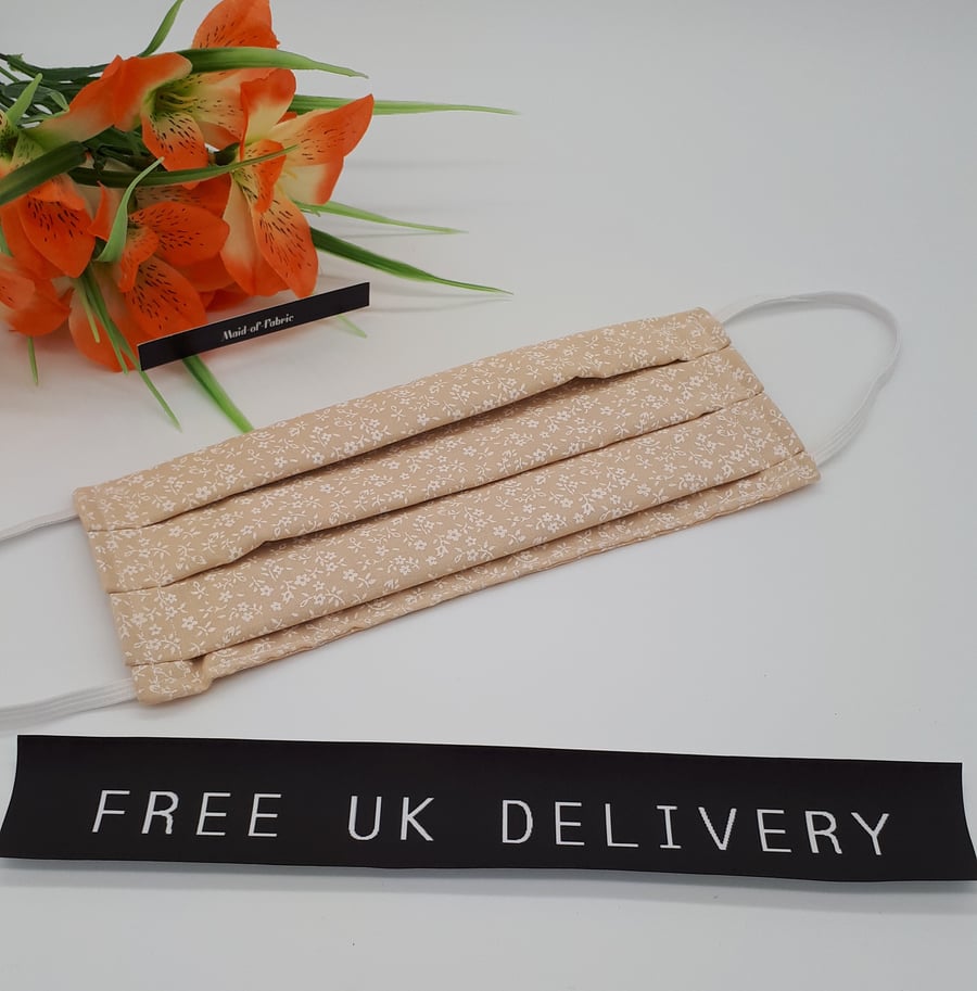 Face mask,  large,  3 layer,  machine washable in peach floral fabric 