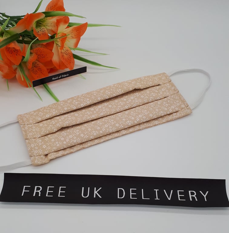 Face mask,  large,  3 layer,  machine washable in peach floral fabric 