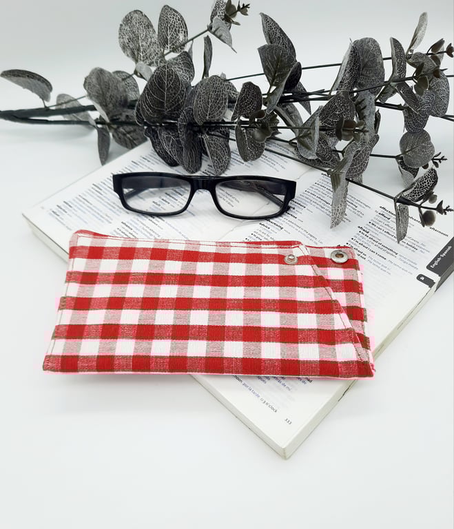 Padded glasses case in red gingham,  popper fastening.  