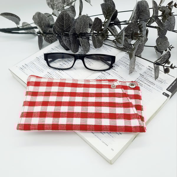 Padded glasses case in red gingham,  popper fastening.  
