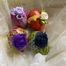 4 solid wooden decorated eggs