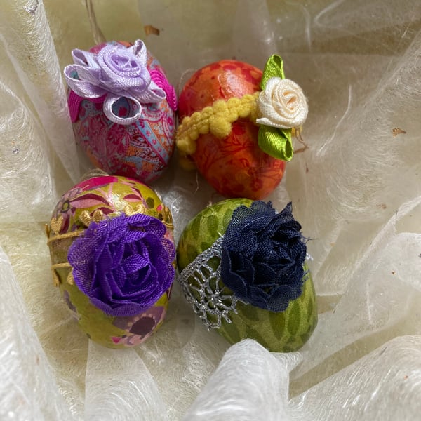 4 solid wooden decorated eggs