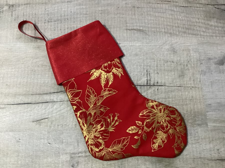 Christmas stocking in red and gold, floral.