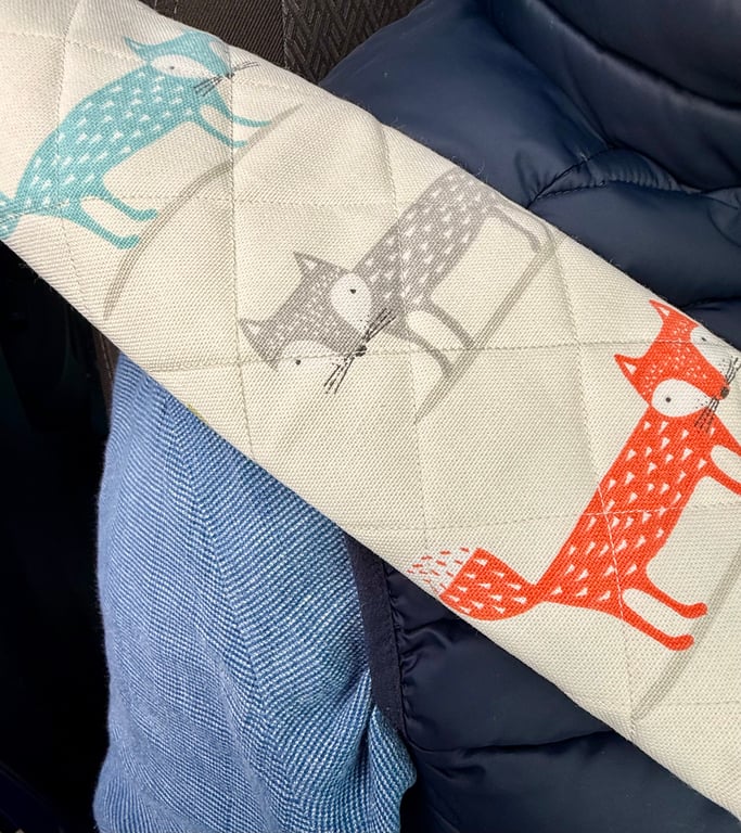 Pair of front seatbelt comfort covers with quirky fox print