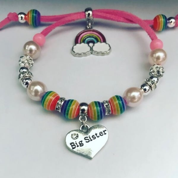 Big sister pink suede effect corded rainbow charm bracelet 