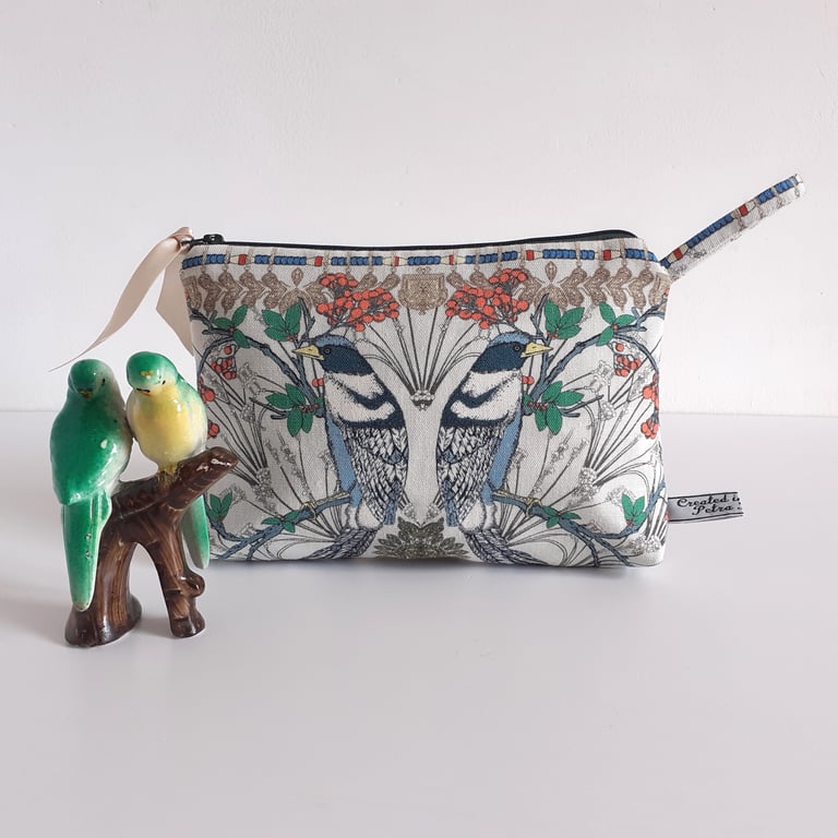 Toiletries or make up bag with an exotic bird print design
