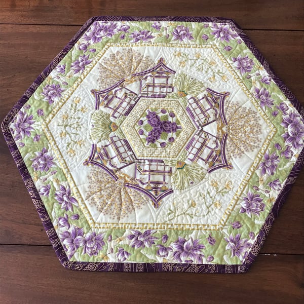 Summer Palace kaleidoscopic quilted table topper plum purple gold