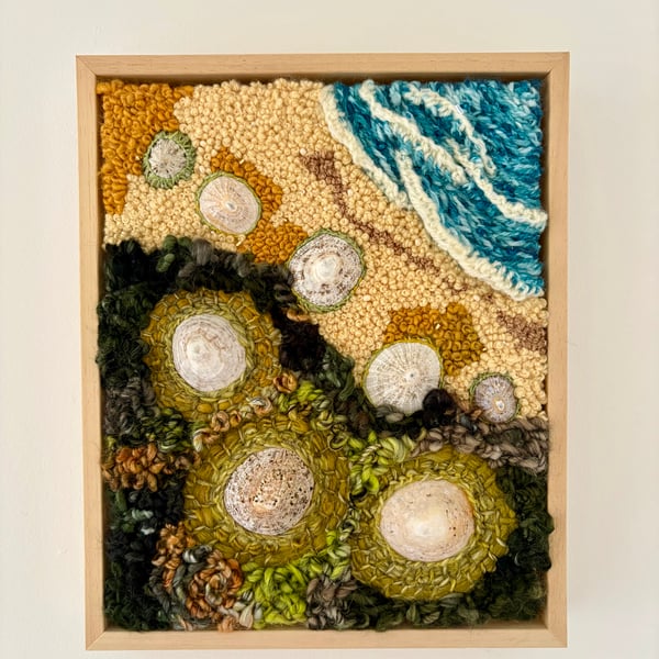 Hand embroidered artwork incorporating seashells - beach strandline