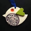 Ceramic patterned bird decoration with heart shaped wing