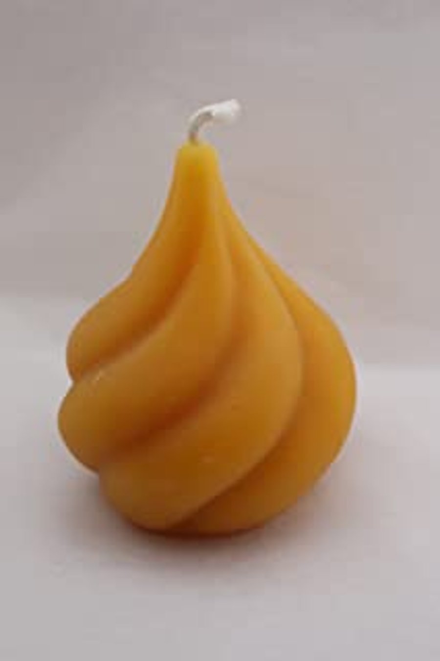 Pear drop twist beeswax candle handmade in mid Wales from organic beeswax