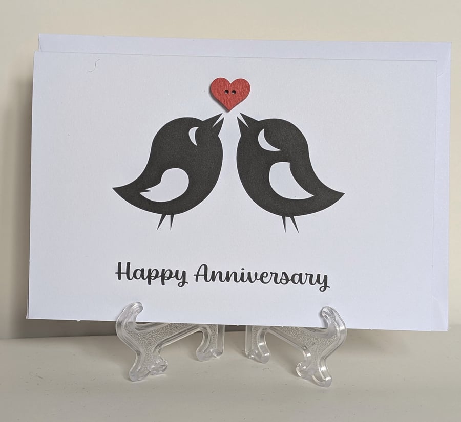 Happy Anniversary love birds with a red heart button greetings card 