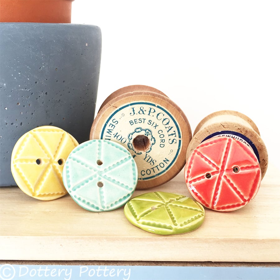 Set of four bright ceramic handmade buttons