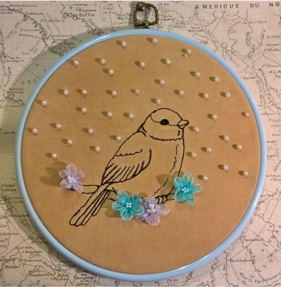 Little bird with silk flowers