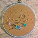 Little bird with silk flowers