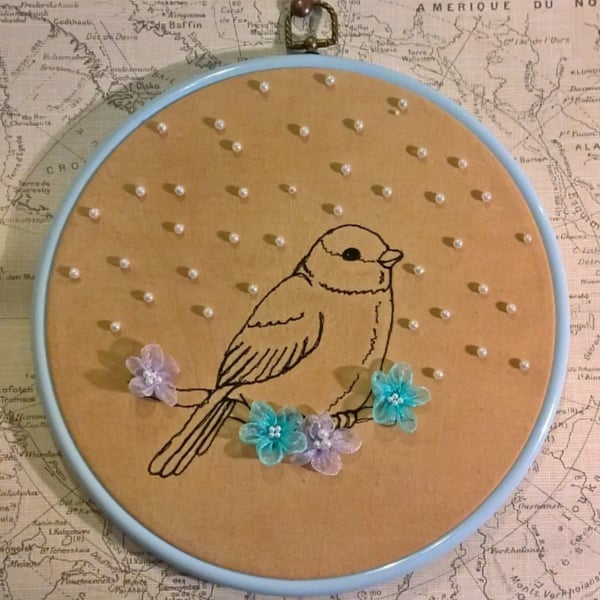 Little bird with silk flowers