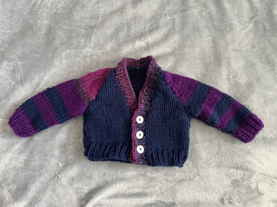 Hand knitted baby cardigan in blue and purple 