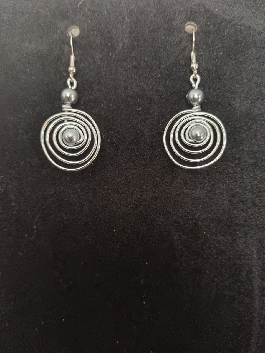 Handmade spiral silver tone drop earring