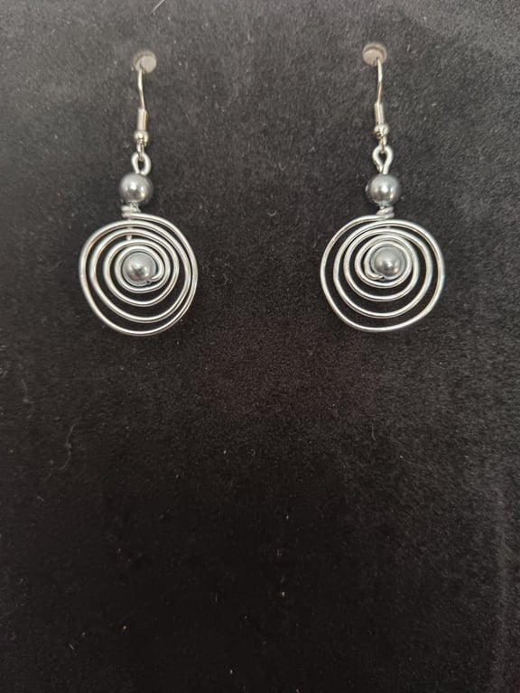 Handmade spiral silver tone drop earring