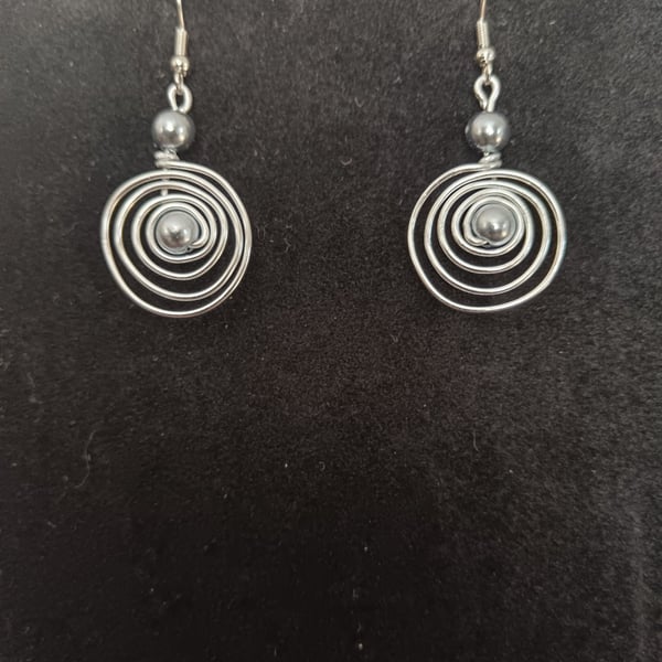 Handmade spiral silver tone drop earring