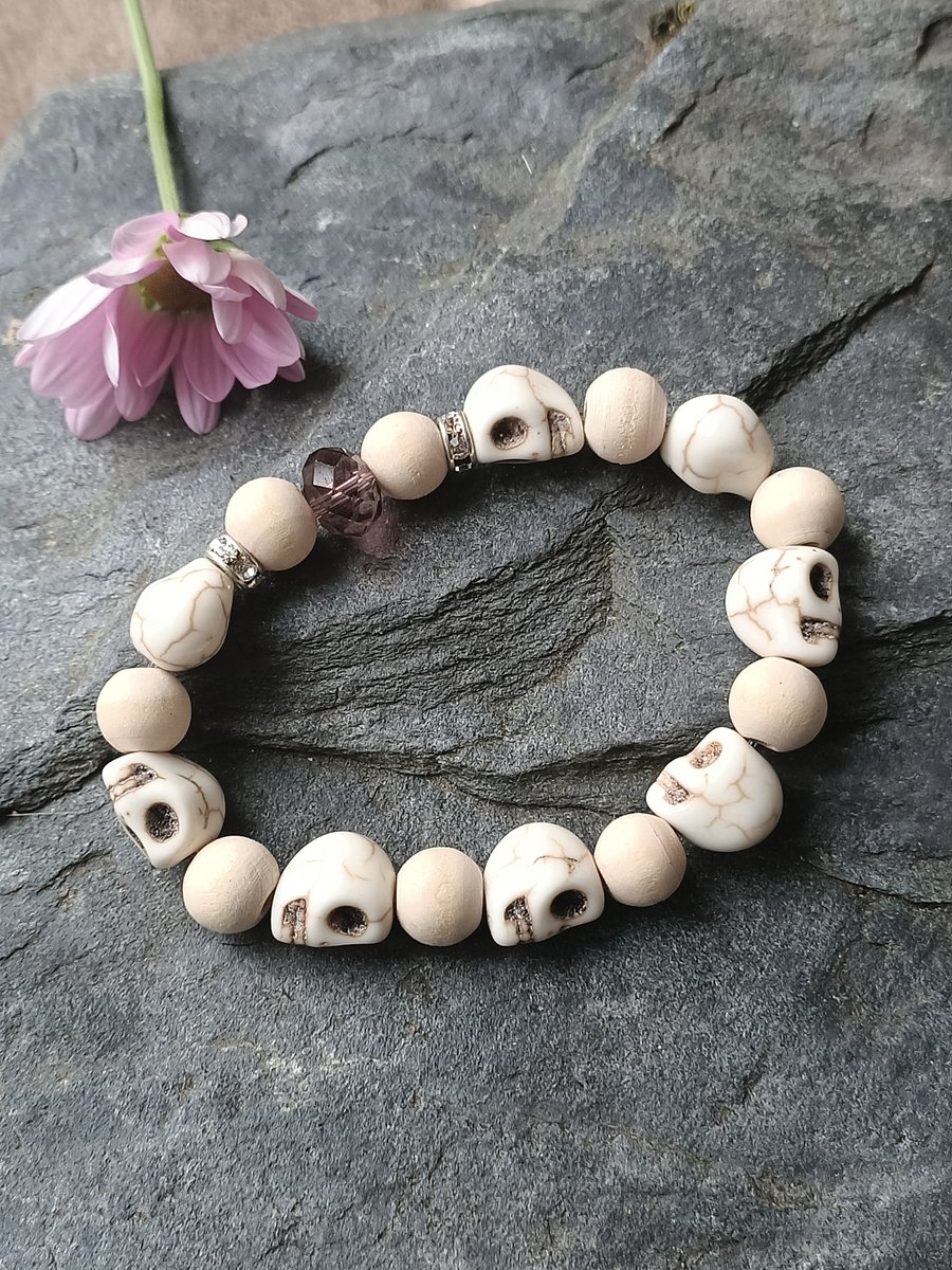 Beaded skull and rose pink coloured wooden stretch elastic bracelet