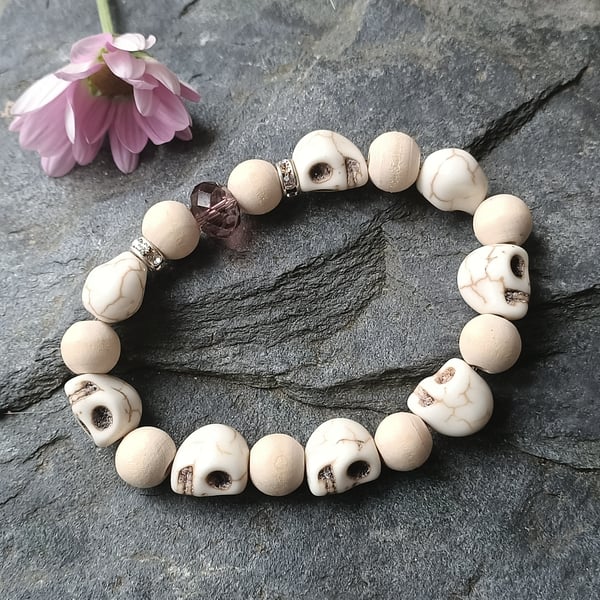 Beaded skull and rose pink coloured wooden stretch elastic bracelet
