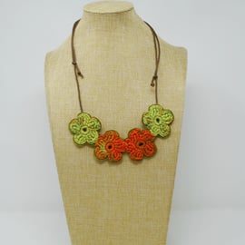 Crochet flower necklace in orange and lime green