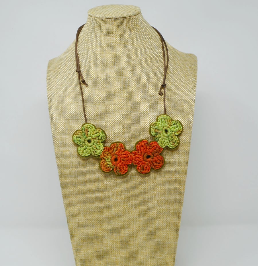 Crochet flower necklace in orange and lime green