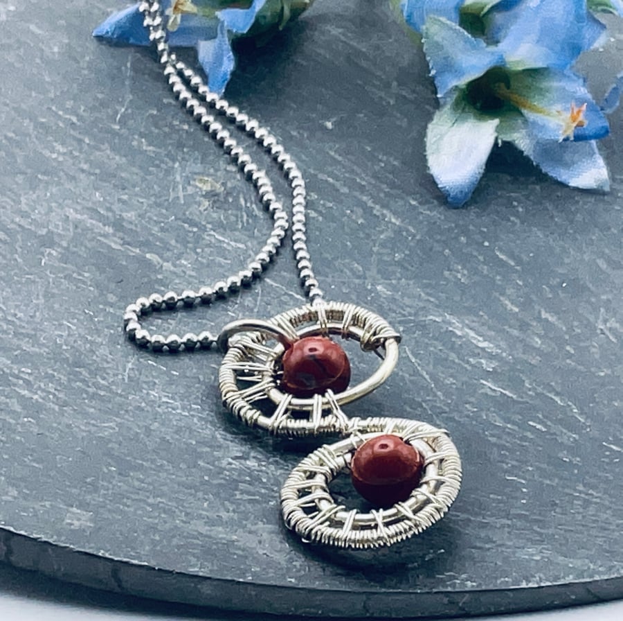 A diminutive filigree fantasy and carnelian silver p